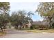 Residential street view featuring a community sign and inviting landscaping at 536 Dunoon St, Ocoee, FL 34761