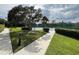 Community tennis court nestled among lush landscaping and mature trees at 536 Dunoon St, Ocoee, FL 34761