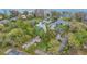 Aerial view of the neighborhood showing well-maintained homes, lush landscaping, and waterfront access at 5569 Jessamine Ln, Orlando, FL 32839