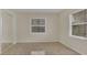 Bright bedroom with tiled floor, neutral walls, blinds, and a mirrored closet at 5569 Jessamine Ln, Orlando, FL 32839