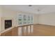 Cozy living room with fireplace and French doors at 5569 Jessamine Ln, Orlando, FL 32839