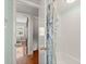 Bright bathroom features a shower with stylish curtain and a built-in shelving unit for added convenience at 7 Clarendon Ct, Daytona Beach, FL 32118