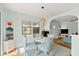 Cozy dining room features a round table, four chairs, and a window for natural light at 7 Clarendon Ct, Daytona Beach, FL 32118