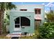 Charming exterior view of a two-story home with a unique architectural style and colorful accents at 7 Clarendon Ct, Daytona Beach, FL 32118