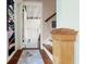 Hallway with hardwood floors, a decorative rug, and stairs leading to the upper level at 7 Clarendon Ct, Daytona Beach, FL 32118