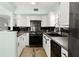 Functional kitchen with white cabinetry, stainless steel appliances, and modern finishes at 7 Clarendon Ct, Daytona Beach, FL 32118