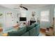 Bright living room with a comfortable sofa, a fireplace, and a large television at 7 Clarendon Ct, Daytona Beach, FL 32118