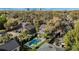 Aerial view of property showing pool, patio, and mature trees in a residential neighborhood at 718 E Livingston St, Orlando, FL 32803