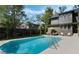 Spacious backyard featuring a refreshing pool, comfortable patio furniture, and a lush green lawn for relaxation at 718 E Livingston St, Orlando, FL 32803