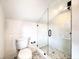Well-lit bathroom featuring modern finishes including a glass walk-in shower and updated fixtures at 718 E Livingston St, Orlando, FL 32803