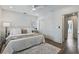 Bright and airy bedroom with neutral decor, ceiling fan, and closet with sliding doors at 718 E Livingston St, Orlando, FL 32803
