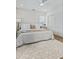 Well-lit bedroom featuring hardwood floors, large rug, and a comfortable bed at 718 E Livingston St, Orlando, FL 32803