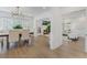 Bright dining room featuring stylish chandelier, wood floors, and open concept living at 718 E Livingston St, Orlando, FL 32803
