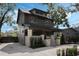 Charming two-story home with landscaped yard, brick walkway, and a welcoming facade at 718 E Livingston St, Orlando, FL 32803