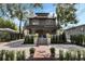 Charming two-story home with landscaped yard, brick walkway, and a welcoming facade at 718 E Livingston St, Orlando, FL 32803