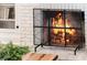 Close-up of fireplace with intricate metal screen at 718 E Livingston St, Orlando, FL 32803