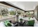 Relaxing front porch with comfortable seating, a patterned rug, and neighborhood views at 718 E Livingston St, Orlando, FL 32803