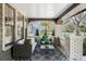 Relaxing front porch with comfortable seating, a patterned rug, and neighborhood views at 718 E Livingston St, Orlando, FL 32803