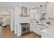 Modern kitchen with stainless steel appliances, white cabinetry and light countertops at 718 E Livingston St, Orlando, FL 32803