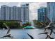 Scenic view of Lake Eola Fountain with modern architecture, lush greenery and bird sculptures at 718 E Livingston St, Orlando, FL 32803