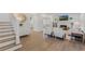Open-concept living room with hardwood floors and ample natural light at 718 E Livingston St, Orlando, FL 32803