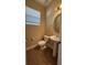 Half bathroom with pedestal sink and neutral color palette at 7525 Colbury Ave, Windermere, FL 34786