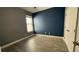 Bedroom with dark accent wall and lots of natural light at 7525 Colbury Ave, Windermere, FL 34786