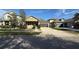 Exterior view of home featuring a manicured lawn, two-car garage, and a inviting front porch at 7525 Colbury Ave, Windermere, FL 34786