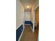 Hallway with ceramic tile flooring and blue wainscoting at 7525 Colbury Ave, Windermere, FL 34786
