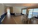 Living room view featuring hard wood flooring, with two-tone wall paint, an chandelier and a dining table at 7525 Colbury Ave, Windermere, FL 34786