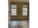 Bright living room with two large windows and neutral paint at 7525 Colbury Ave, Windermere, FL 34786