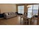 Living room view featuring hard wood flooring, with two-tone wall paint, an chandelier and a dining table at 7525 Colbury Ave, Windermere, FL 34786