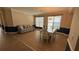 Living room view featuring hard wood flooring, with two-tone wall paint, an chandelier and a dining table at 7525 Colbury Ave, Windermere, FL 34786