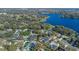 Aerial view of the property in relation to the neighborhood and lake at 825 Rosemere Cir, Orlando, FL 32835