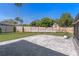 Spacious backyard featuring a new paved patio and a wood fence for privacy at 825 Rosemere Cir, Orlando, FL 32835