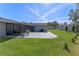New paver patio with a screened-in lanai and green grass area, perfect for relaxing at 825 Rosemere Cir, Orlando, FL 32835