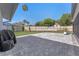Spacious backyard with a new gray patterned patio and lush landscaping at 825 Rosemere Cir, Orlando, FL 32835