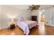Bedroom with ceramic floors, floral bedding, and a glimpse of a hallway at 825 Rosemere Cir, Orlando, FL 32835