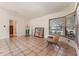Bright living room with tile floors, a bay window and an artist's easel at 825 Rosemere Cir, Orlando, FL 32835
