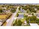 Aerial view shows fenced-in backyard of a single Gathering home, storage shed, mature trees in a residential neighborhood at 864 Naples Dr, Orlando, FL 32804