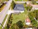 Charming home features a well-maintained lawn, wooden deck, and a storage shed in a fenced yard at 864 Naples Dr, Orlando, FL 32804