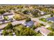 Aerial view of a single Gathering home with fenced in backyard, storage shed and close to mature trees and streets at 864 Naples Dr, Orlando, FL 32804