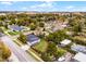An aerial view of a single Gathering home with a spacious backyard in a neighborhood setting. The yard is enclosed by a fence at 864 Naples Dr, Orlando, FL 32804