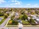 Charming home with a well-maintained lawn, fenced yard, and city views in the distance at 864 Naples Dr, Orlando, FL 32804