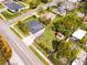 Charming home features a well-maintained lawn, wooden deck, and a storage shed in a fenced yard at 864 Naples Dr, Orlando, FL 32804
