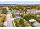 Aerial view of a single Gathering home with fenced yard and storage shed surrounded by mature trees in a residential neighborhood at 864 Naples Dr, Orlando, FL 32804