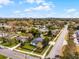 Charming home with a well-maintained lawn, fenced yard, and city views in the distance at 864 Naples Dr, Orlando, FL 32804
