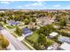 Charming home with a well-maintained lawn, fenced yard, and city views in the distance at 864 Naples Dr, Orlando, FL 32804