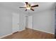 A bright bedroom with hardwood floors and a ceiling fan at 864 Naples Dr, Orlando, FL 32804
