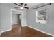 Bedroom with hardwood floors, ceiling fan, and a window providing natural light at 864 Naples Dr, Orlando, FL 32804